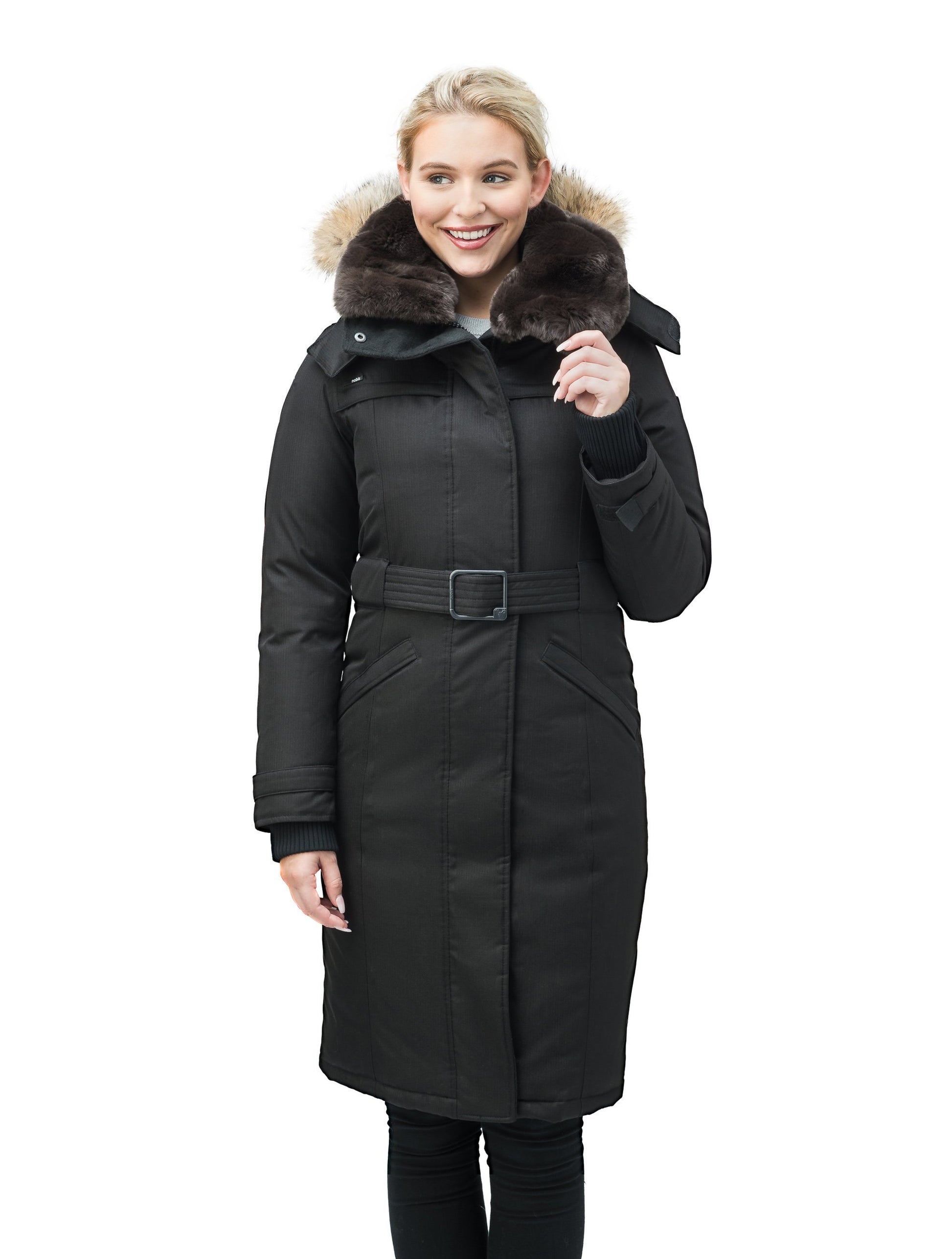 Women's knee length down filled parka with a belted waist and fully removable Coyote and Rex Rabbit fur ruffs in CH Black