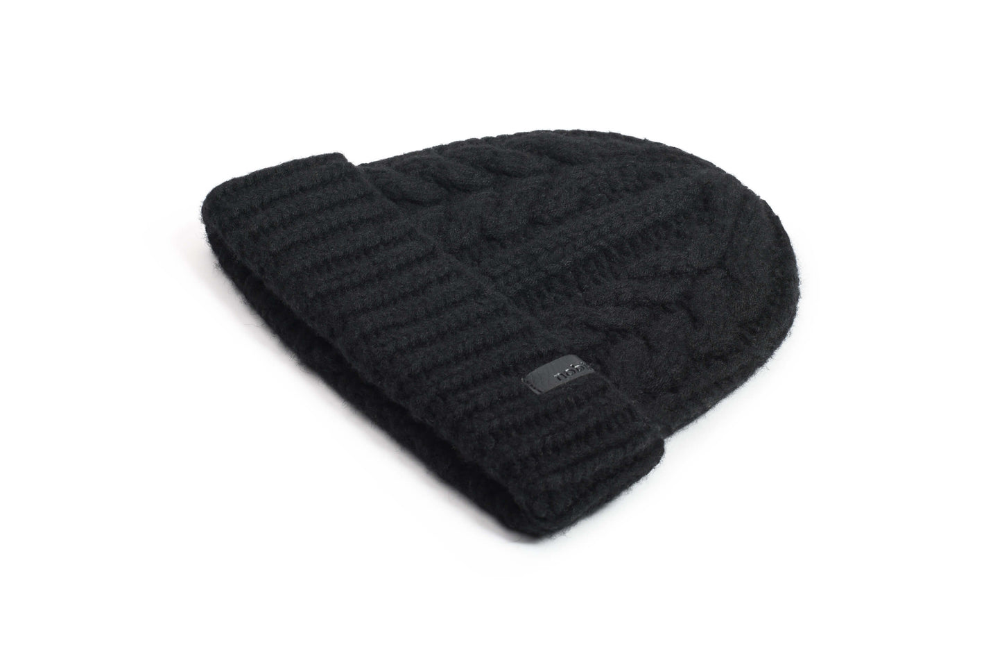 Dew Unisex Cable Knit Beanie in superfine merino wool and cashmere, and nobis leather label at cuff, in Black